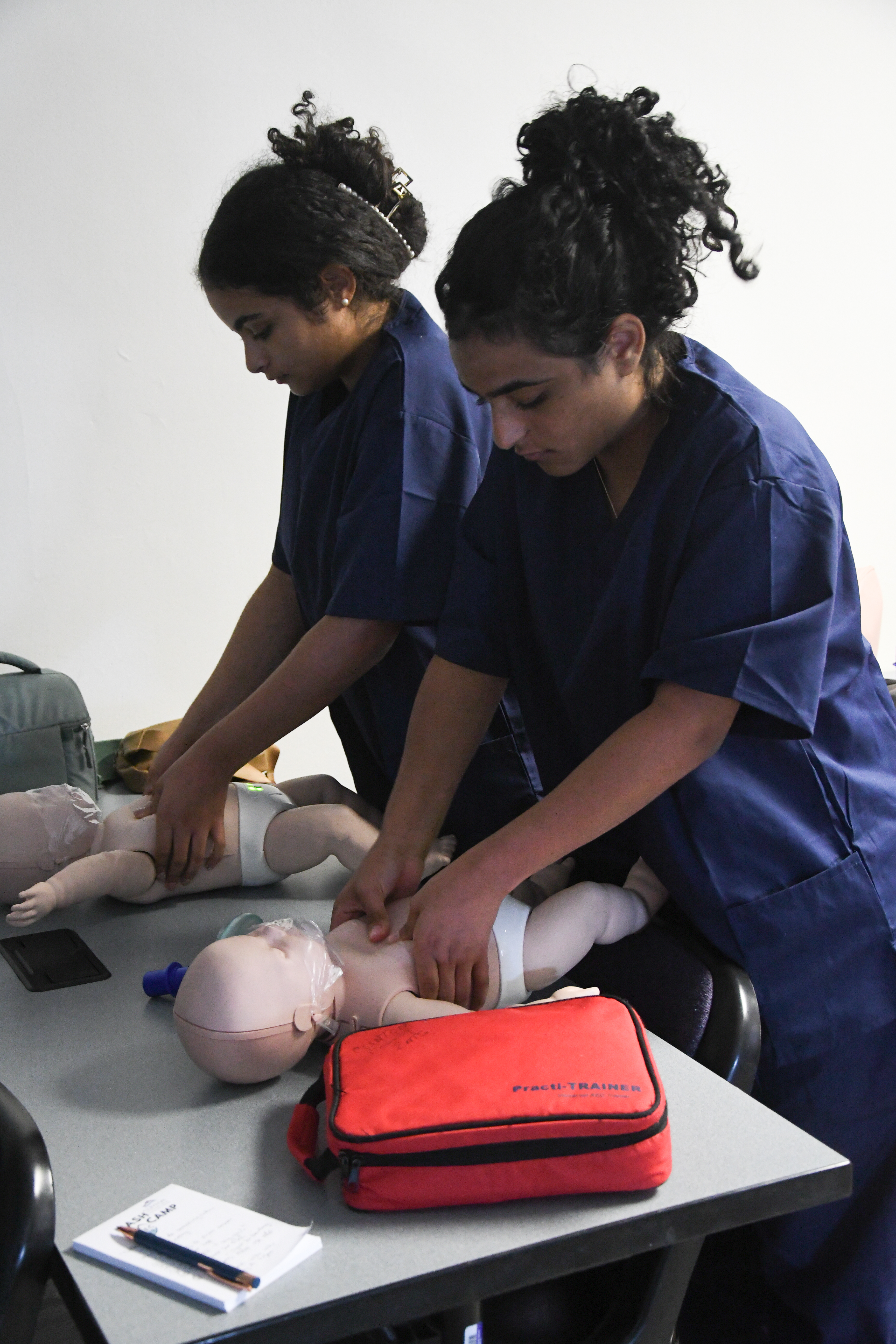 students practicing CPR