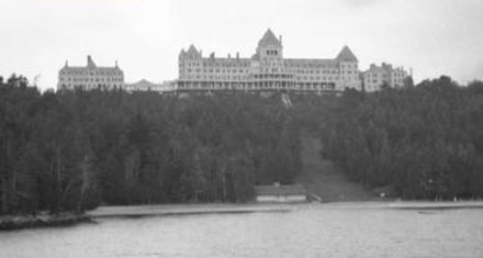 Black and white photo of Hotel Champlain take from the lake.