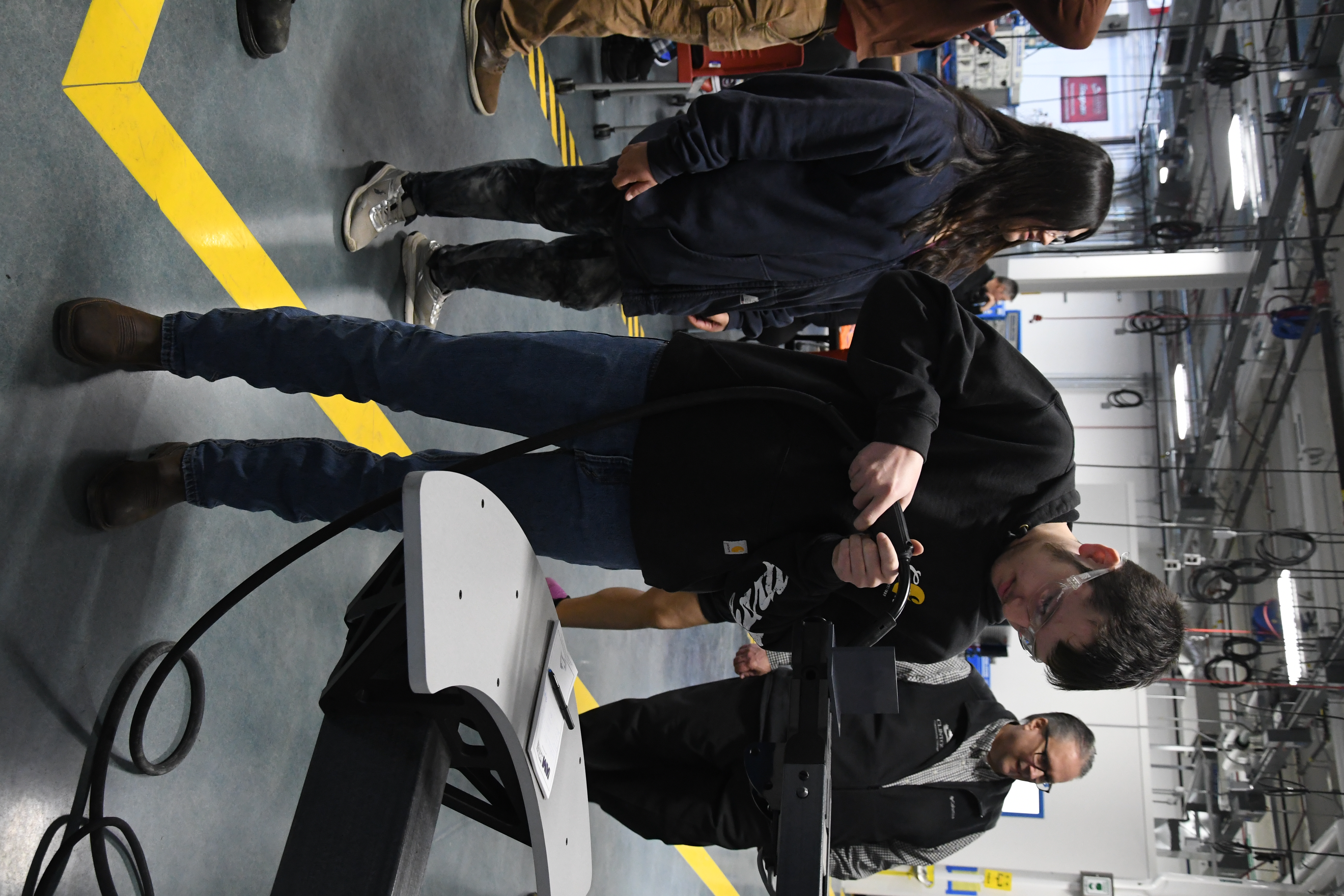 Male Student Using the Welding Simulation Machine