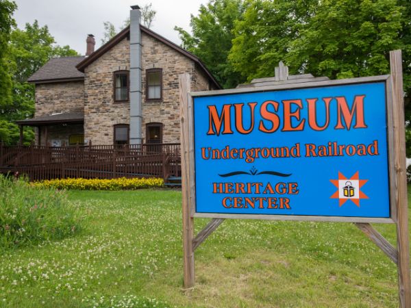 The front of and the sign of the North Star Underground Railroad Museum.