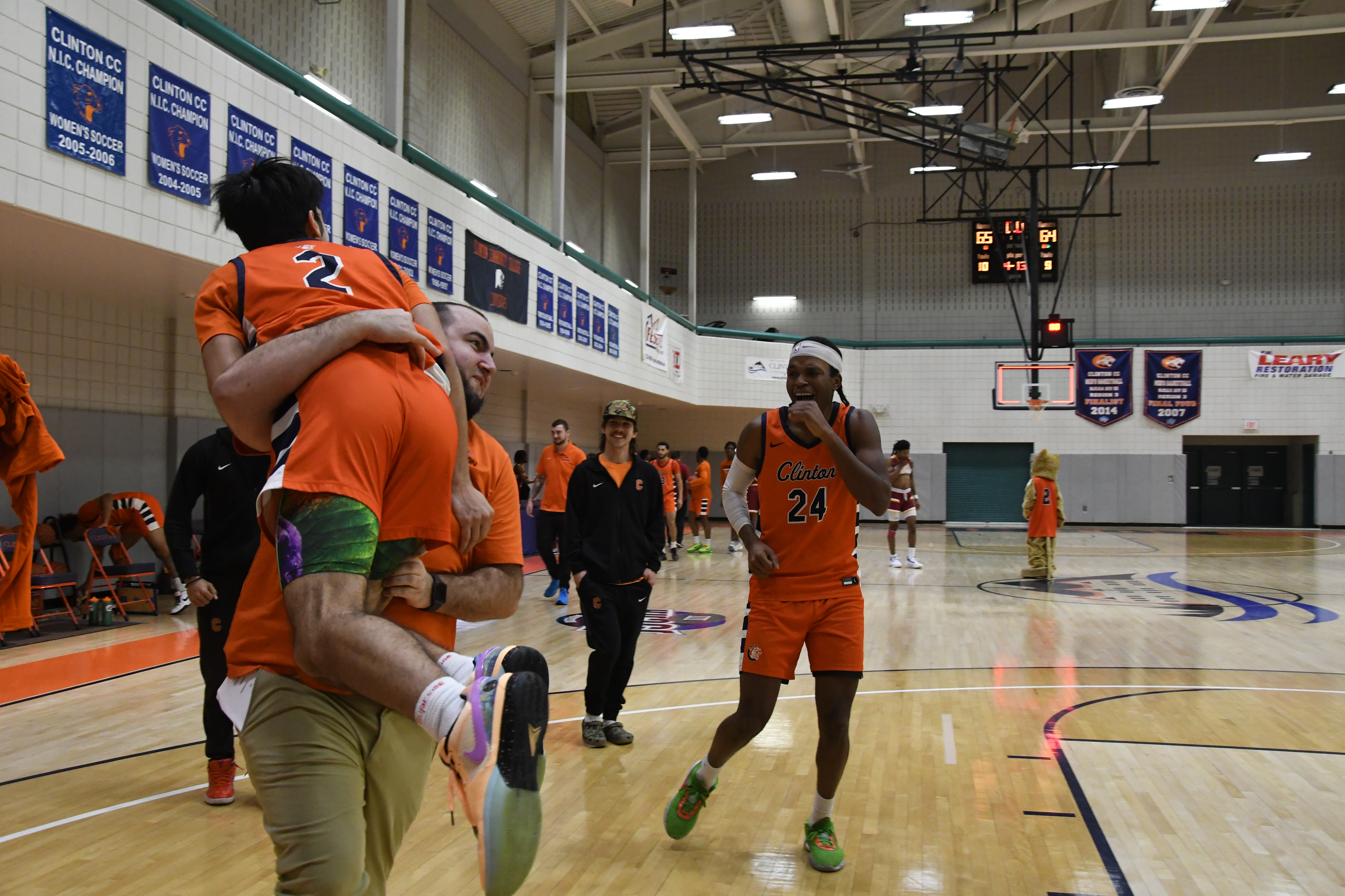player and coach celebrating