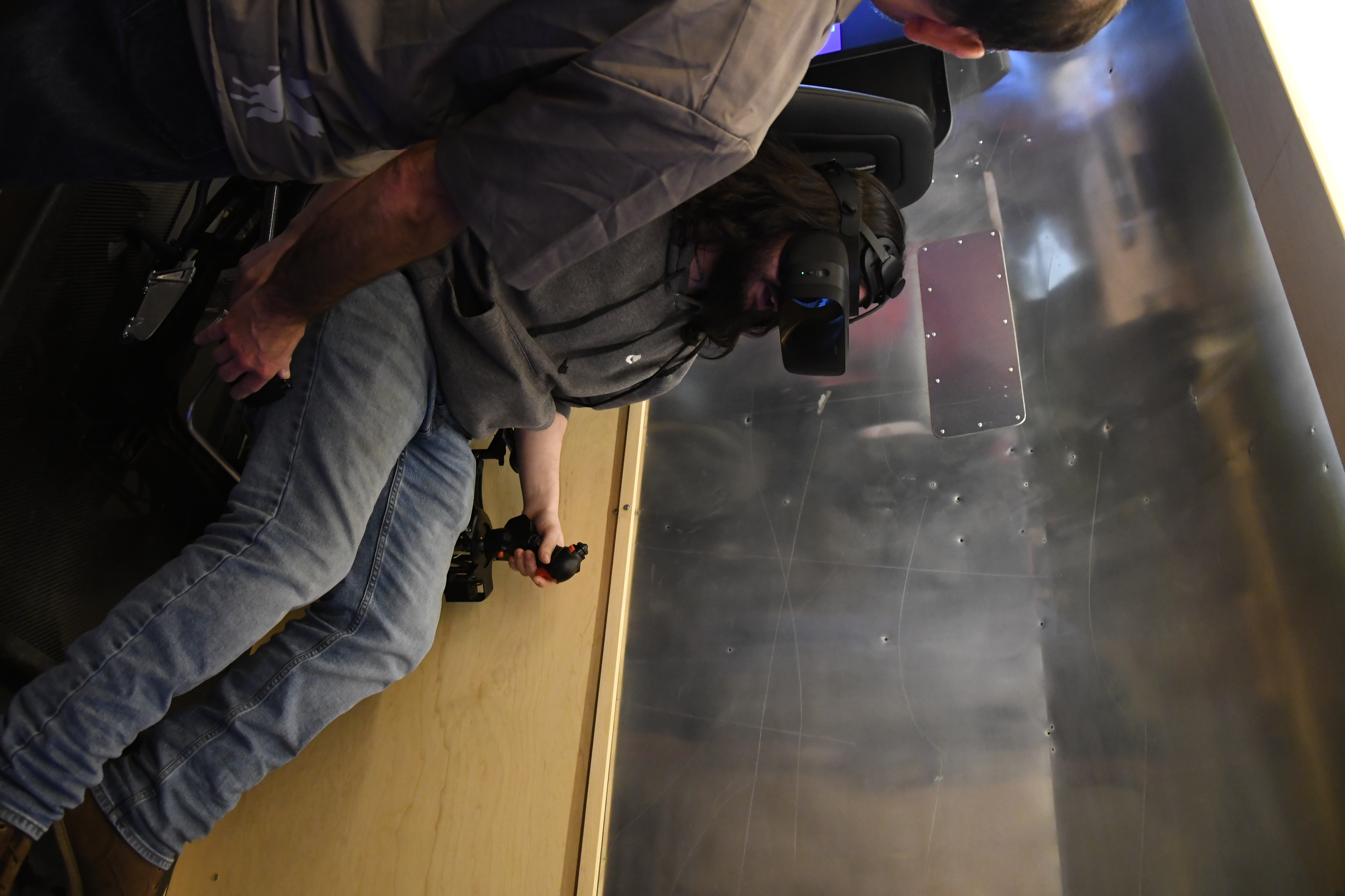 student usingf VR flying a plane
