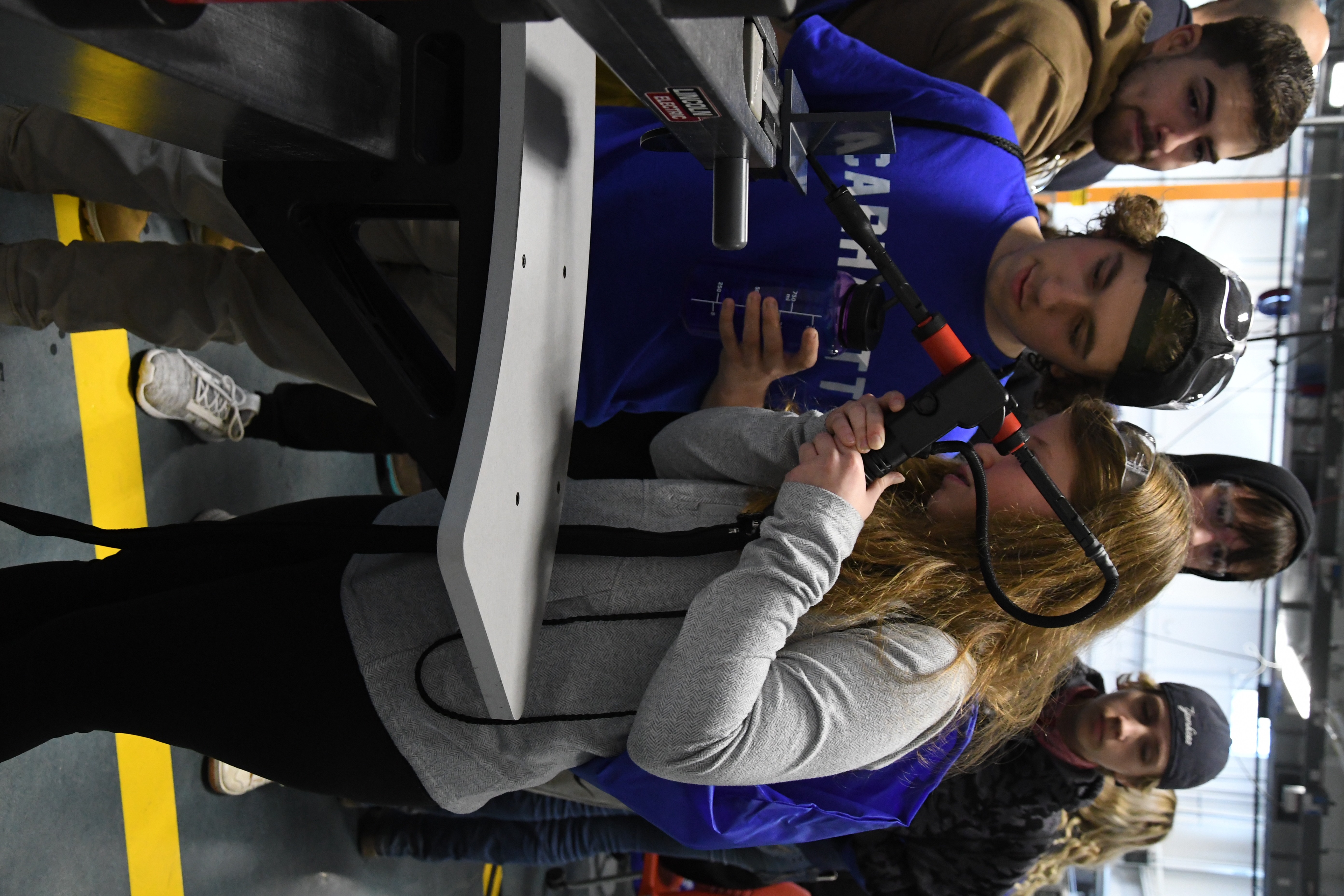two students using the welding simulation
